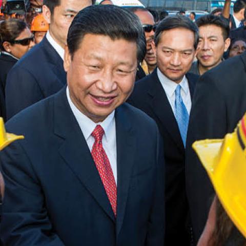 Xi Jinping shakes hands with Chinese workers at a construction site in Port-of-Spain, Trinidad and Tobago, on June 1, 2013. (Frederic Dubray/AFP via Getty Images)