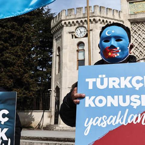 People gather for an exhibition called "Not a joke, a genocide" to raise awareness against China's policies and human rights violations towards Uyghurs in Istanbul, Turkey on March 14, 2021. (Photo by Onur Coban/Anadolu Agency via Getty Images)