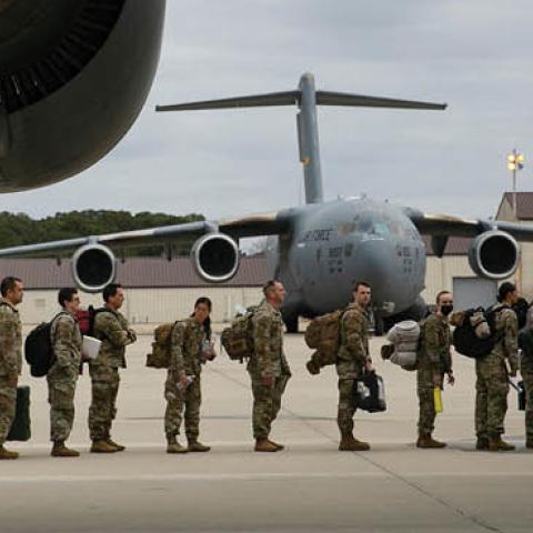 U.S. troops deploy for Europe from Pope Army Airfield at Fort Bragg, North Carolina, on February 3, 2022. (Photo by ALLISON JOYCE/AFP via Getty Images)