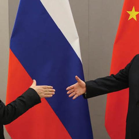 Russian President Vladimir Putin greets Chinese Leader Xi Jinping during their bilateral meeting on November 13, 2019 in Brasilia, Brazil. (Photo by Mikhail Svetlov/Getty Images)