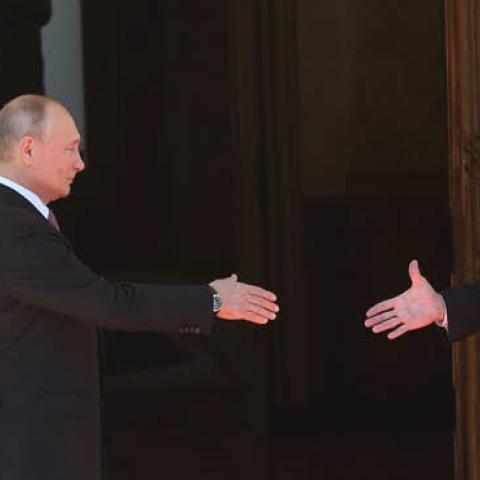 Russian President Vladimir Putin greets U.S. President Joe Biden during the U.S.-Russia Summit 2021 at the La Grange Villa near the Geneva Lake, on June 16, 2021 in Geneva, Switzerland. (Photo by Mikhail Svetlov/Getty Images)