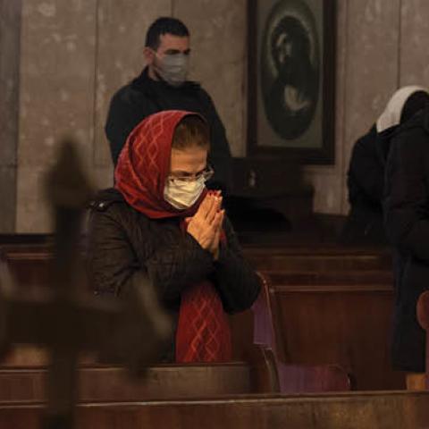 Iranian-Christians pray during a New Year mass prayer ceremony in the Saint Gregory church in Tehran on January 1, 2021. (Getty Images)