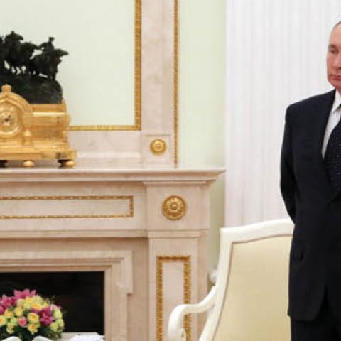 Russian President Vladimir Putin stands in a hall before a meeting with his Belarus counterpart at the Kremlin in Moscow on March 11, 2022. (Getty Images)