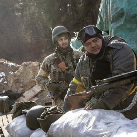 Members of the Ukrainian military wait at a forward position on the eastern frontline near Kalynivka village as Russian forces advanced on March 08, 2022, in Kyiv, Ukraine. (Photo by Chris McGrath/Getty Images)