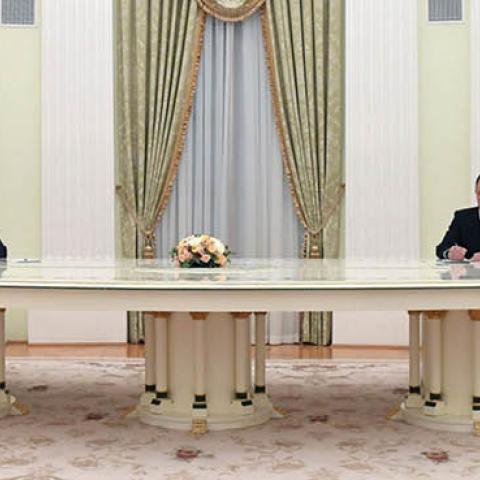 Russian President Vladimir Putin speaks with Iranian President Ebrahim Raisi during their meeting in Moscow on January 19, 2022. (Photo by Pavel Bednyakov/Sputnik/AFP via Getty Images)
