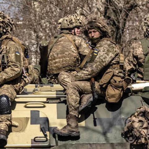 Ukrainian soldiers sit on a armored military vehicle in the city of Severodonetsk, Donbas region, on April 7, 2022. (Photo by Fadel Senna/AFP via Getty Images)