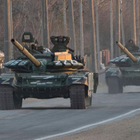 A column of tanks marked with the Z symbol proceeds northwards along the Mariupol-Donetsk highway. (Photo by Maximilian Clarke via Getty Images)