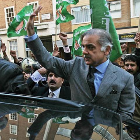 Shahbaz Sharif waves to supporters outside of the Pakistan Embassy during a protest by the Pakistan Muslim League on November, 7, 2007 in London, England. (Photo by Daniel Berehulak/Getty Images)