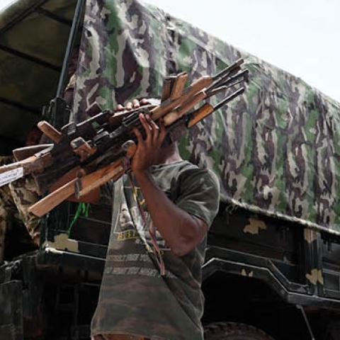 Nigerian soldiers load small arms and light weapons recovered from bandits during Operation Safe Haven on a military truck on April 21, 2022  in Plateau State in northcentral Nigeria. (Photo by Pius Utomi Ekpei/AFP via Getty Images)