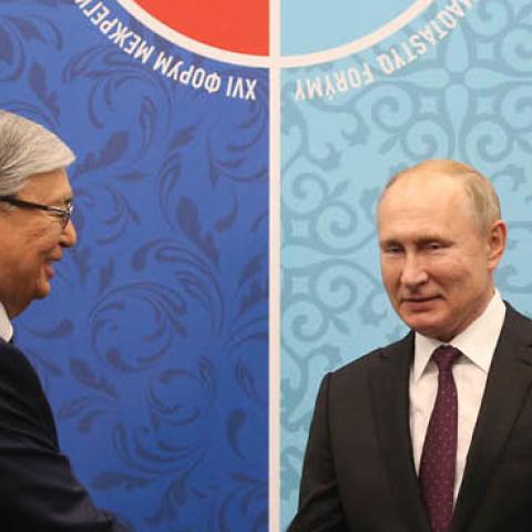 Kazakh President Kassym-Jomart Tokayev greets Russian President Vladimir Putin during their bilaterlal meeting at the Russian-Kazakh Regional Forum on November 7, 2019 in Omsk, Russia. (Photo by Mikhail Svetlov/Getty Images)