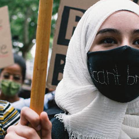 Woman in a hijab takes part in Black Lives Matter protest in Cologne, Germany, on June 7, 2020. (Photo by Ying Tang/NurPhoto via Getty Images)
