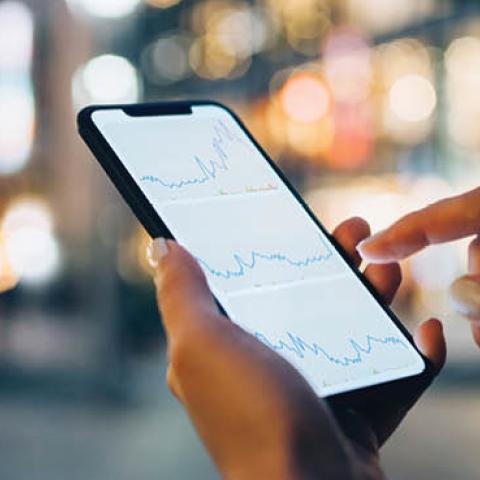 Financial data displayed on a smartphone. (Getty Images)