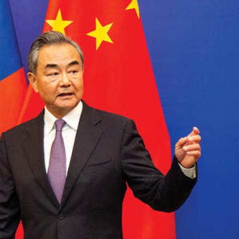 Chinese Foreign Minister Wang Yi leaves after a joint press conference with Fijian Prime Minister Frank Bainimarama in Fiji's capital city Suva. (Photo by Leon Lord/AFP via Getty Images)