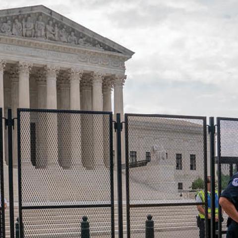 Law enforcement guard the front of the Supreme Court on June 14, 2022 in Washington, DC. (Photo by Nathan Howard/Getty Images)