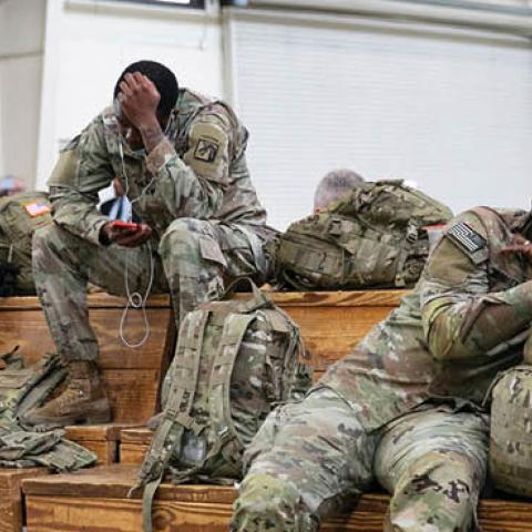 U.S. service members wait at the Pope Army Airfield before deploying to Europe at Fort Bragg, North Carolina, on February 3, 2022. (Allison Joyce/AFP via Getty Images)