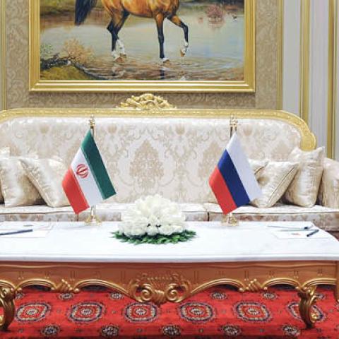 Russian President Vladimir Putin speaks with Iran's President Ebrahim Raisi during their meeting on the sidelines of the 6th Caspian Summit in Ashgabat on June 29, 2022. (Photo by Mikhail Klimentyev/SPUTNIK / AFP via Getty Images)