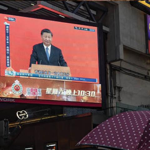 Xi Jinping speaks during a news conference, displayed on a television screen at a shopping area on June 30, 2022, in Hong Kong. (Photo by Anthony Kwan/Getty Images)