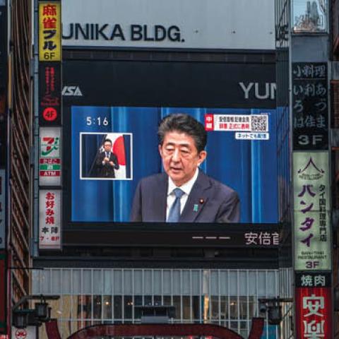 Japan's Prime Minister Shinzo Abe appears on a giant television screen during a press conference announcing his resignation on August 28, 2020, in Tokyo, Japan. (Photo by Carl Court/Getty Images)