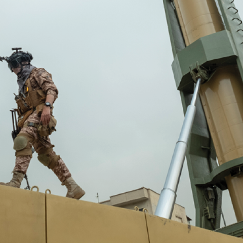 An Islamic Revolutionary Guard Corps (IRGC) military personnel walks next to an Iranian Emad Surface-to-Surface missile in downtown Tehran. (Photo by Morteza Nikoubazl/NurPhoto via Getty Images)