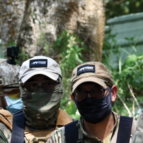  Taiwanese civilians in tactical gear and replica weapons taking part in an urban warfare workshop on June 18 in Linko district, New Taipei City. (Photo by Sam Yeh / AFP)