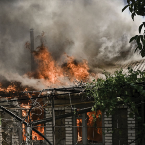 A house burns after being shelled during an artillery duel between Ukrainian and Russian troops in the city of Lysychansk, Ukraine, on June 11, 2022. (Photo by Aris Messinis/AFP via Getty Images)