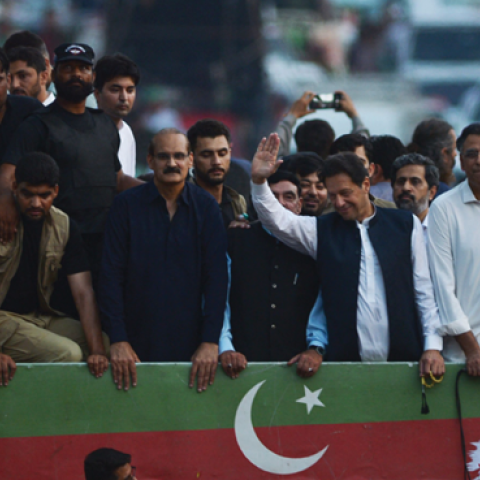 Former Pakistani Prime Minister Imran Khan waves to supporters in Rawalpindi, Pakistan, on July 2, 2022, during a protest rally against inflation, political destabilization, and hikes in fuel prices. (Photo by Farpq Naeem/AFP via Getty Images)