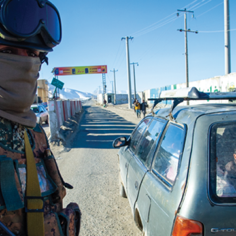  Taliban fighters check vehicles and passengers at a security checkpoint on January 14, 2022, in Kabul, Afghanistan. (Photo by Scott Peterson/Getty Images) 