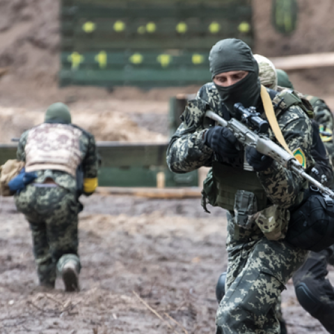 Members of the Ukrainian Territorial Defense Forces participate in tactical exercises in the forest near Kyiv, Ukraine, on July 13, 2022. (Maxym Marusenko/NurPhoto via Getty Images)