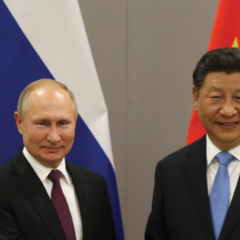 Russian President Vladimir Putin greets Chinese President Xi Jinping during their bilateral meeting on November 13, 2019, in Brasilia, Brazil. (Mikhail Svetlov/Getty Images)