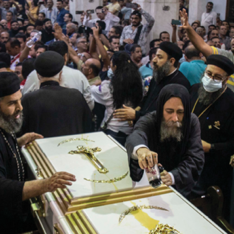 Mourners react during a funeral for victims killed in a fire at a Coptic church in Giza on August 14, 2022. (Mahmoud Elkhwas/NurPhoto via Getty Images)