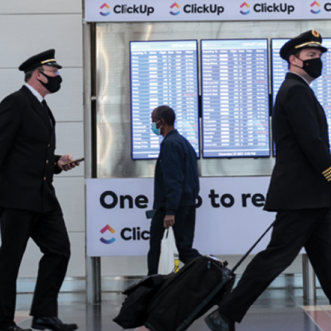 Airline pilots walk through the Ronald Reagan Washington National Airport on December 27, 2021, in Arlington, Virginia. (Anna Moneymaker/Getty Images)